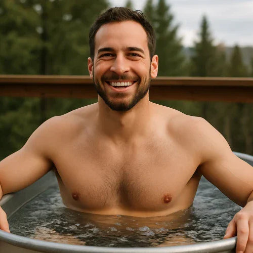 smiling man in cold plunge tub
